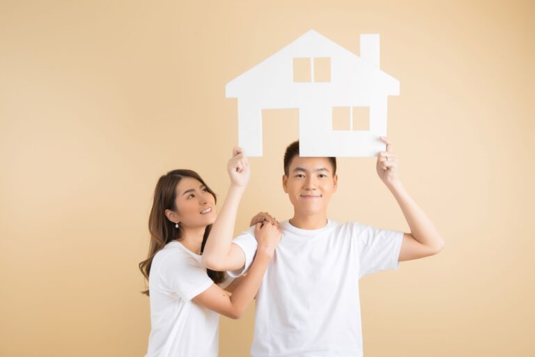young-happy-asian-couple-presenting-symbols-house