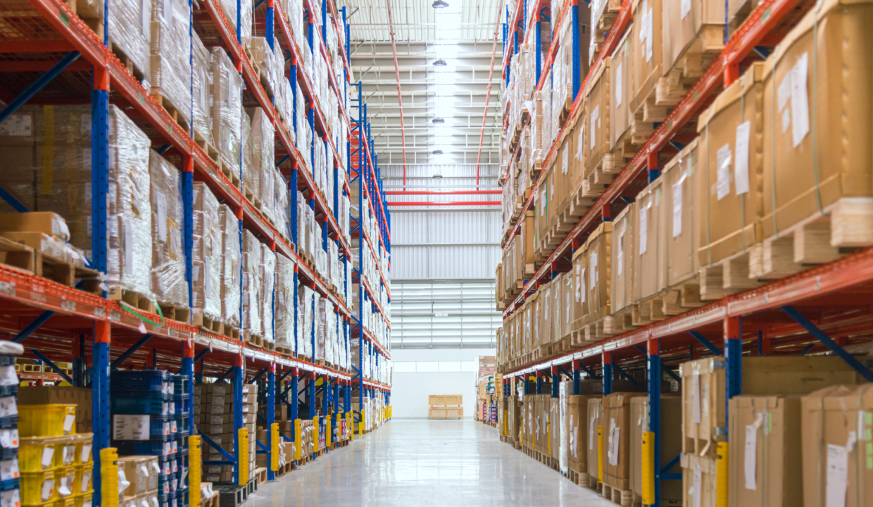 Modern warehouse interior with neatly organized shelves filled with goods, showcasing the growth and efficiency of Indonesia's warehousing industry.