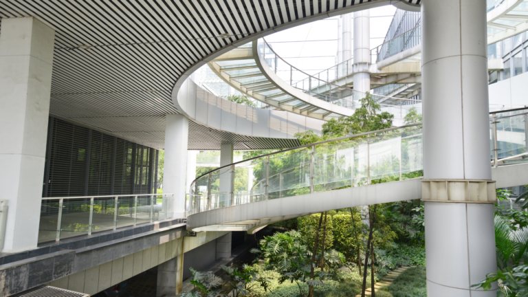 Modern green-certified office building in Jakarta featuring lush greenery and sustainable design, highlighting Indonesia green building certification.