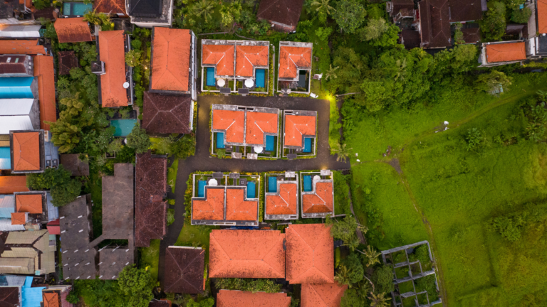 A view of Bali villa's surrounded by lush greenery from above portraying the importance of complying to spatial planning regulation in Bali.