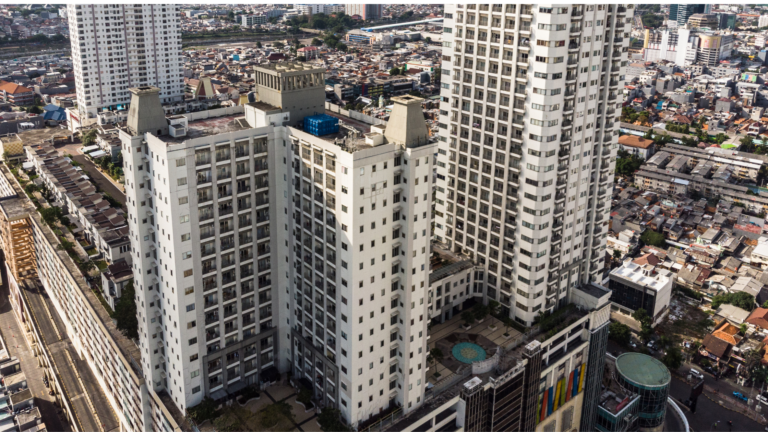Aerial view of high-rise apartment buildings in Jakarta, Indonesia, showcasing the growing Jakarta Rental Apartment Market with modern residential towers surrounded by urban housing and commercial areas.