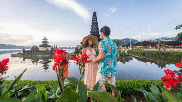 A couple holding hands during their honeymoon in Bali.
