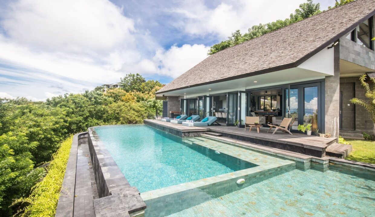 Luxury Bali villa with an infinity pool and lush green surroundings, perfect for leasing property in Bali.
