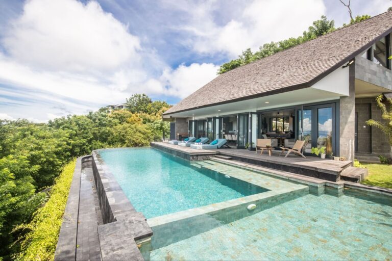 Luxury Bali villa with an infinity pool and lush green surroundings, perfect for leasing property in Bali.