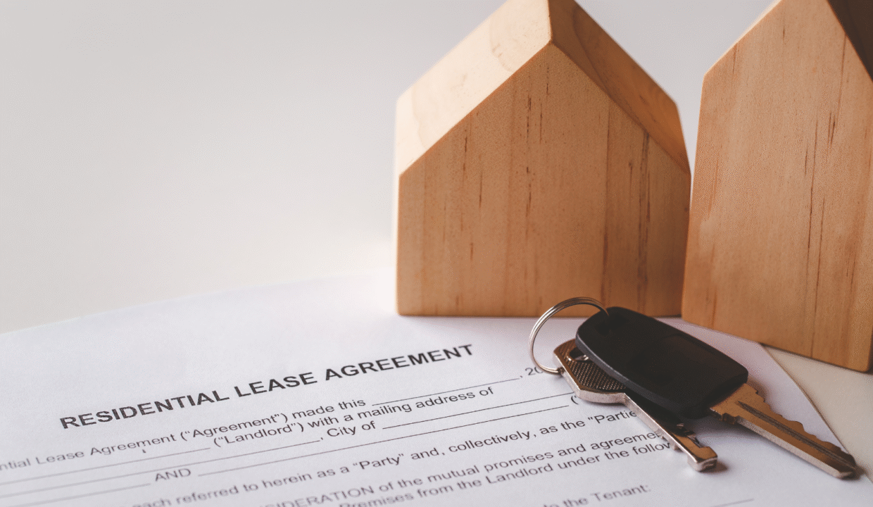 Hak sewa lease agreement with house model and keys symbolizing property lease in Indonesia