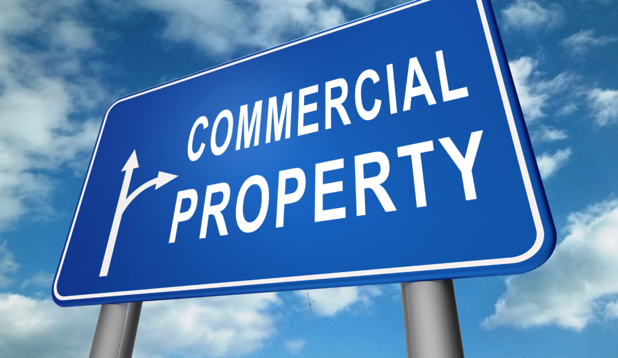 Big road sign that says commercial property with arrows symbolizing investment in Commercial property in Bali