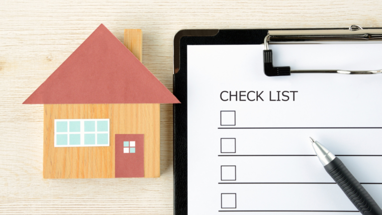 House model beside a clipboard checklist illustrating a checklist for buying a villa in Bali