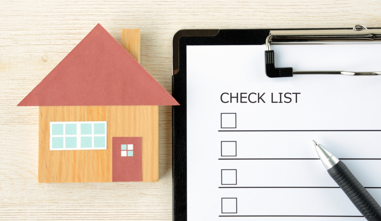 An origami of a house and a checklist symbolizing a villa buying guide in Bali 2026